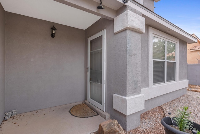 6308 Turquoise Trl NE, Rio Rancho, NM 87144 - view of exterior entry with stucco siding