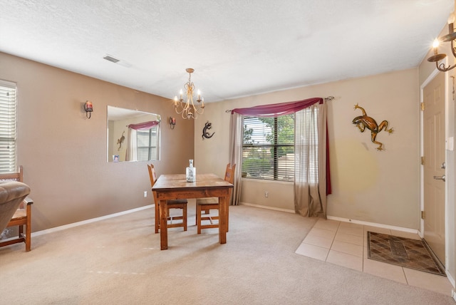 6308 Turquoise Trl NE, Rio Rancho, NM 87144 - dining space featuring plenty of natural light, a chandelier, baseboards, and light colored carpet