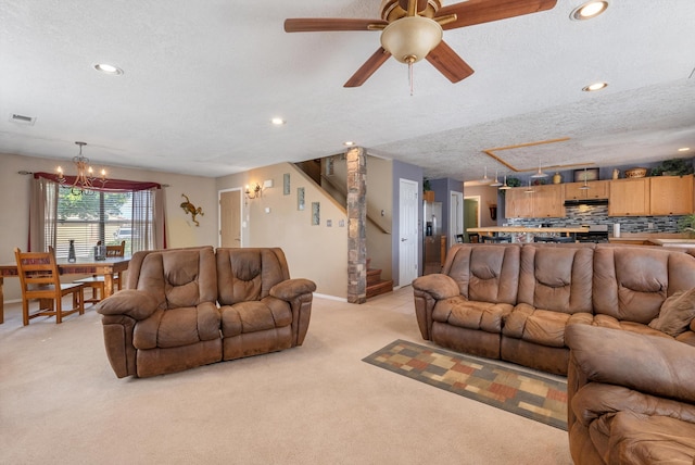 6308 Turquoise Trl NE, Rio Rancho, NM 87144 - living area featuring light colored carpet, a chandelier, a textured ceiling, stairway, and recessed lighting