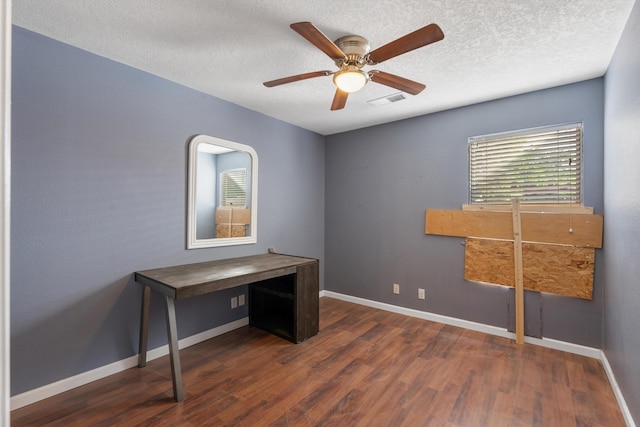 6308 Turquoise Trl NE, Rio Rancho, NM 87144 - unfurnished office with wood finished floors, baseboards, a textured ceiling, and a ceiling fan