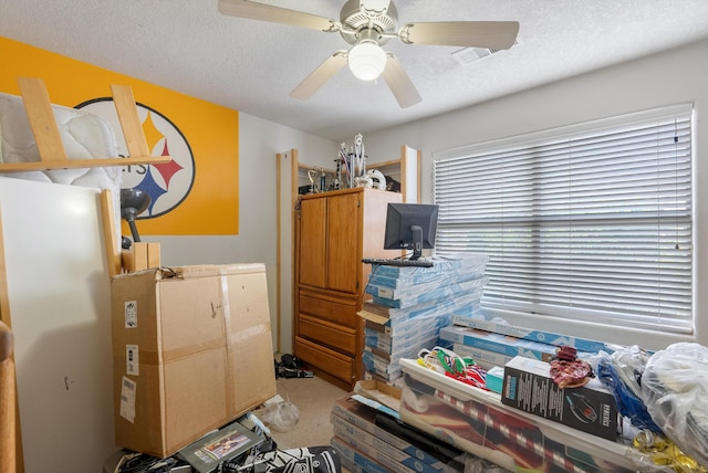 6308 Turquoise Trl NE, Rio Rancho, NM 87144 - miscellaneous room featuring a ceiling fan, light colored carpet, and a textured ceiling