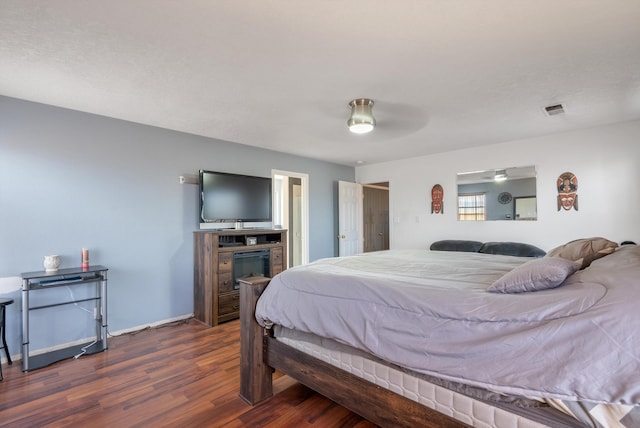 6308 Turquoise Trl NE, Rio Rancho, NM 87144 - bedroom featuring dark wood-type flooring, baseboards, and ceiling fan