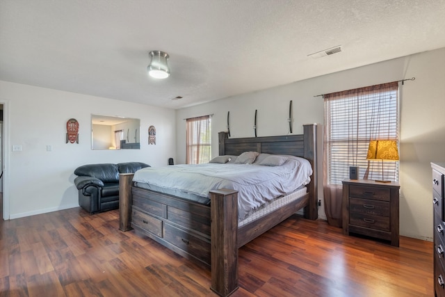 6308 Turquoise Trl NE, Rio Rancho, NM 87144 - bedroom with dark wood-style flooring