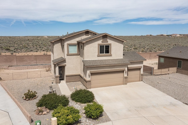 221 Landing Trl, Rio Rancho, NM 87124 - view of front facade with stucco siding, driveway, and an attached garage