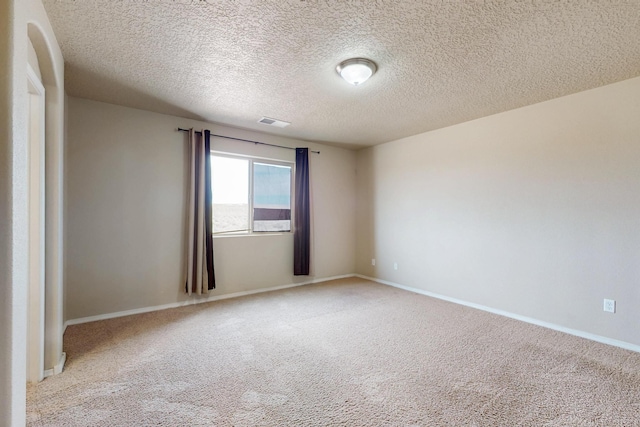 221 Landing Trl, Rio Rancho, NM 87124 - carpeted spare room with a textured ceiling and baseboards