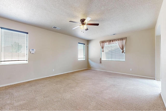 221 Landing Trl, Rio Rancho, NM 87124 - empty room with a ceiling fan, carpet flooring, a textured ceiling, and baseboards