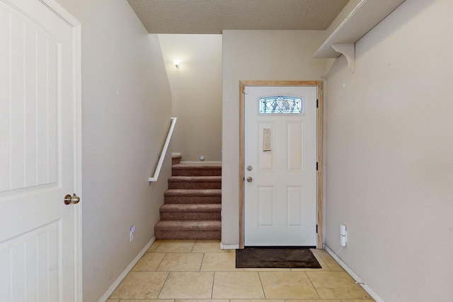221 Landing Trl, Rio Rancho, NM 87124 - entryway featuring stairs, baseboards, and a textured ceiling