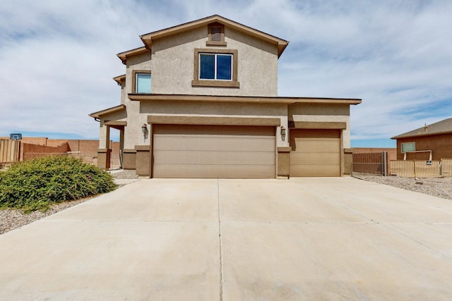 221 Landing Trl, Rio Rancho, NM 87124 - traditional-style home featuring stucco siding, an attached garage, and concrete driveway