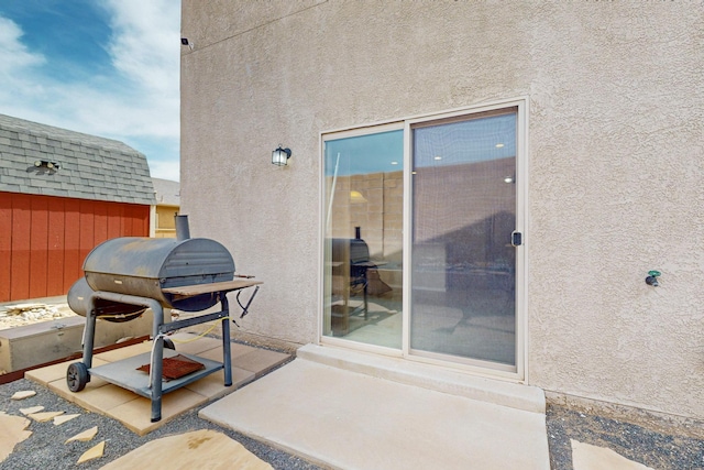 221 Landing Trl, Rio Rancho, NM 87124 - view of exterior entry featuring stucco siding and a patio