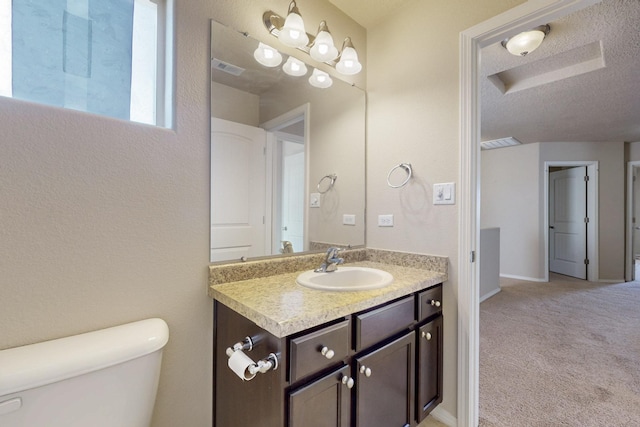 221 Landing Trl, Rio Rancho, NM 87124 - bathroom featuring toilet, vanity, and a textured ceiling