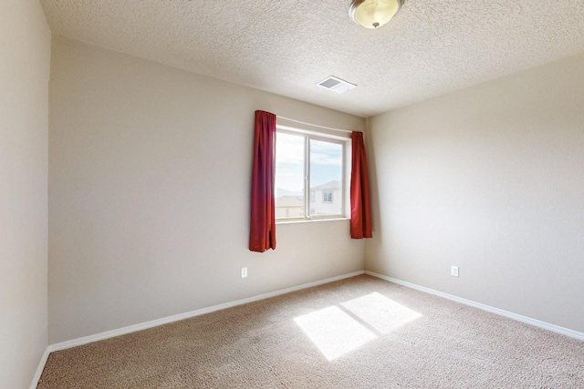 221 Landing Trl, Rio Rancho, NM 87124 - spare room featuring carpet, a textured ceiling, and baseboards