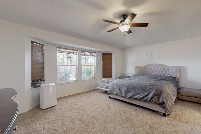 1034 Wagon Trail St, Los Lunas, NM 87031 - carpeted bedroom with baseboards and ceiling fan