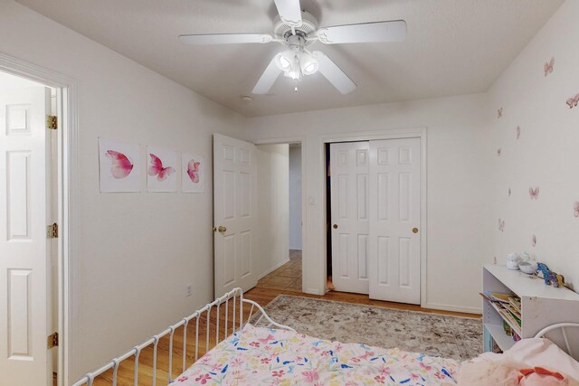 1034 Wagon Trail St, Los Lunas, NM 87031 - bedroom with wood finished floors, a closet, and ceiling fan
