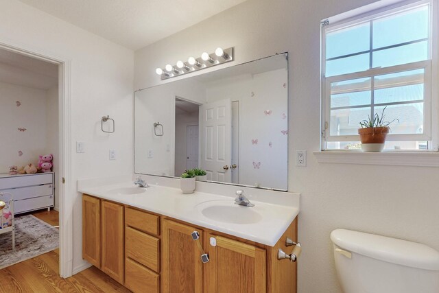 1034 Wagon Trail St, Los Lunas, NM 87031 - full bathroom featuring double vanity and wood finished floors