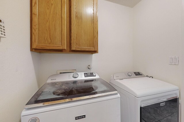 1034 Wagon Trail St, Los Lunas, NM 87031 - washroom featuring cabinet space and washer and clothes dryer