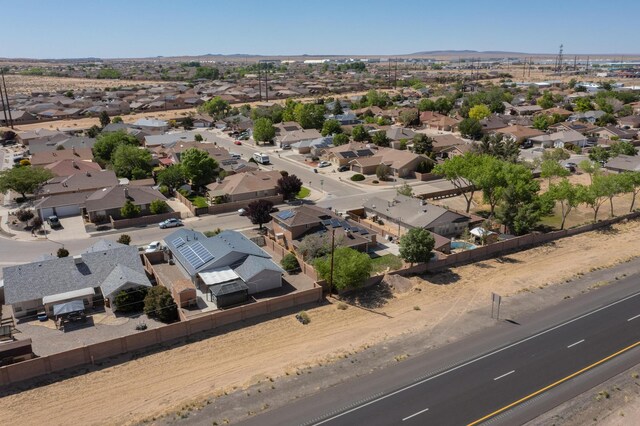 1034 Wagon Trail St, Los Lunas, NM 87031 - aerial view of residential area featuring a mountain backdrop