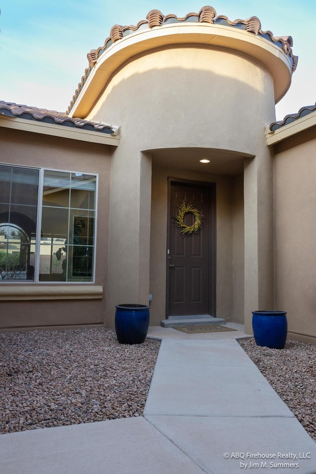 8704 Espacio Verde Rd, Albuquerque, NM 87120 - doorway to property featuring stucco siding