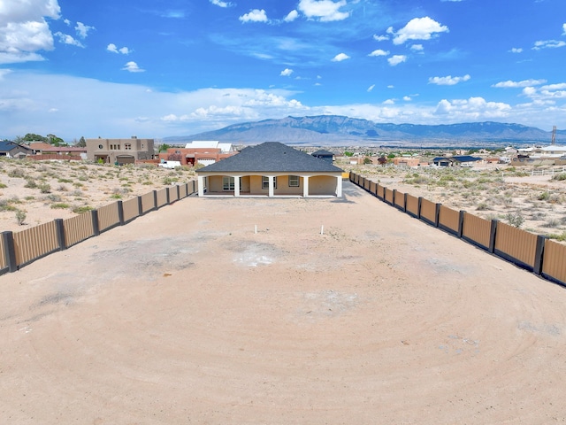 1209 11th St SE, Rio Rancho, NM 87124 - exterior space featuring a mountain view and a porch