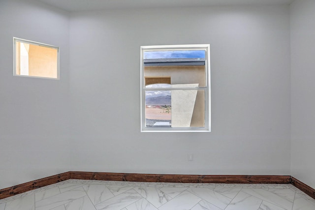 1209 11th St SE, Rio Rancho, NM 87124 - unfurnished room featuring baseboards and marble finish flooring
