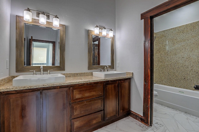 1209 11th St SE, Rio Rancho, NM 87124 - bathroom featuring double vanity, marble finish floors, toilet, and shower / tub combination