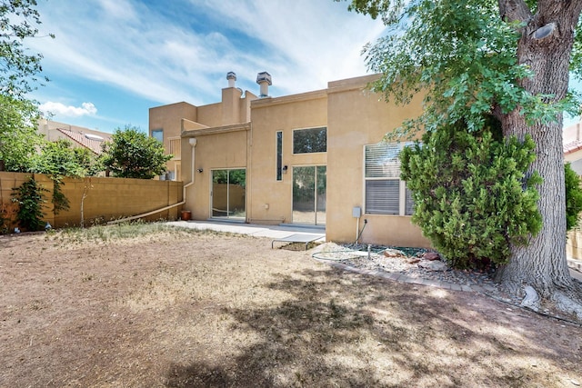 10809 Academy Ridge Rd NE, Albuquerque, NM 87111 - back of house with stucco siding