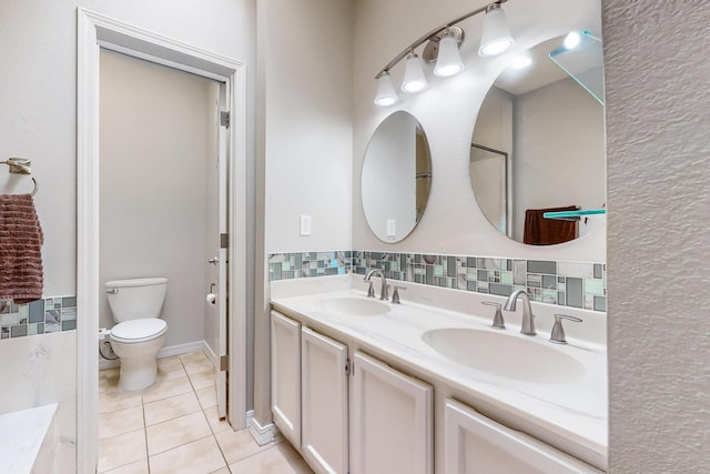 10809 Academy Ridge Rd NE, Albuquerque, NM 87111 - bathroom featuring tile patterned flooring, double vanity, and toilet
