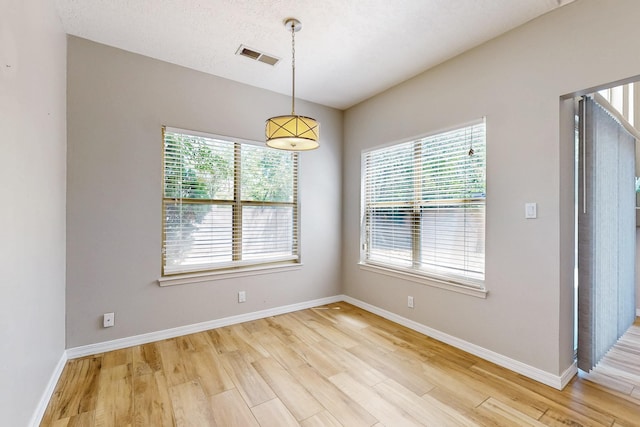 10809 Academy Ridge Rd NE, Albuquerque, NM 87111 - empty room with healthy amount of natural light, light wood-style floors, and baseboards