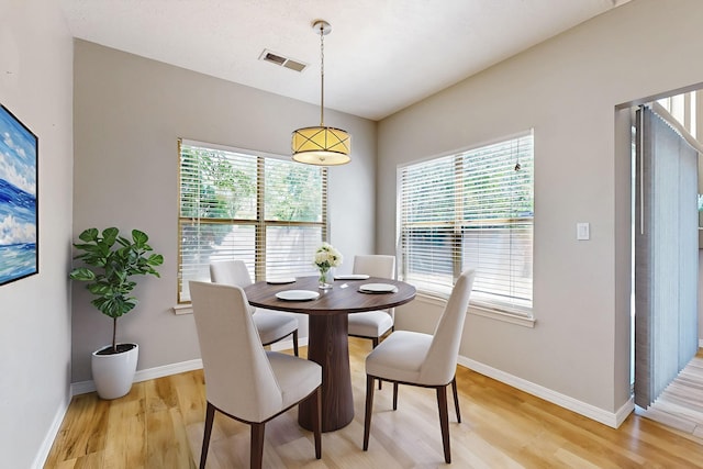 10809 Academy Ridge Rd NE, Albuquerque, NM 87111 - dining area featuring light wood-type flooring, healthy amount of natural light, and baseboards