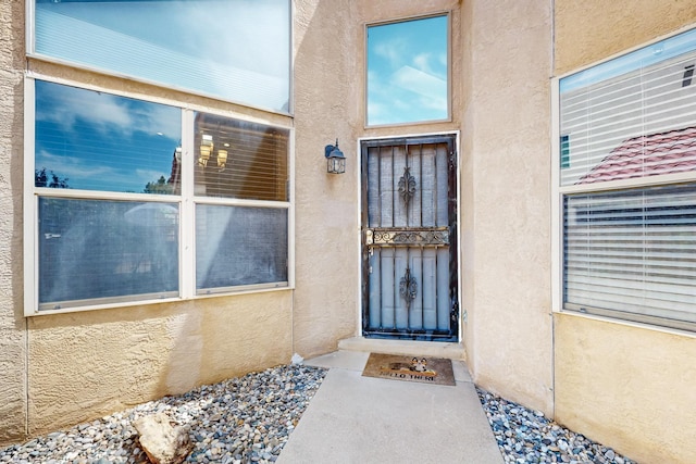 10809 Academy Ridge Rd NE, Albuquerque, NM 87111 - doorway to property with stucco siding