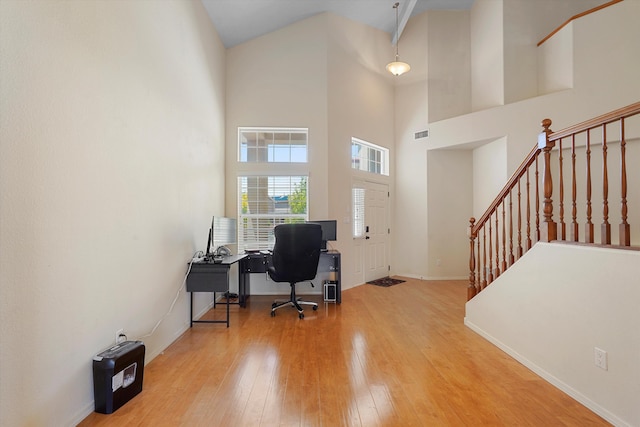 1311 Mirador Loop NE, Rio Rancho, NM 87144 - office space with wood-type flooring, baseboards, and a high ceiling