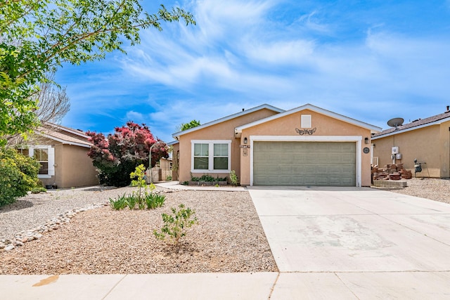 3742 Cattle Dr, Rio Rancho, NM 87144 - ranch-style house featuring stucco siding, a garage, and concrete driveway