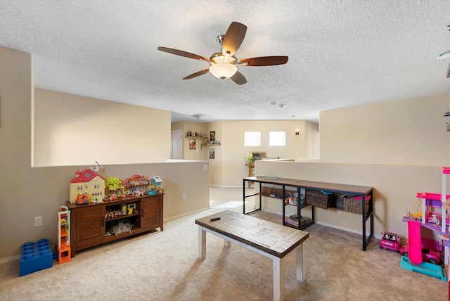 2004 Rancho Oro Ave SE, Rio Rancho, NM 87124 - recreation room featuring a ceiling fan, a textured ceiling, and carpet flooring