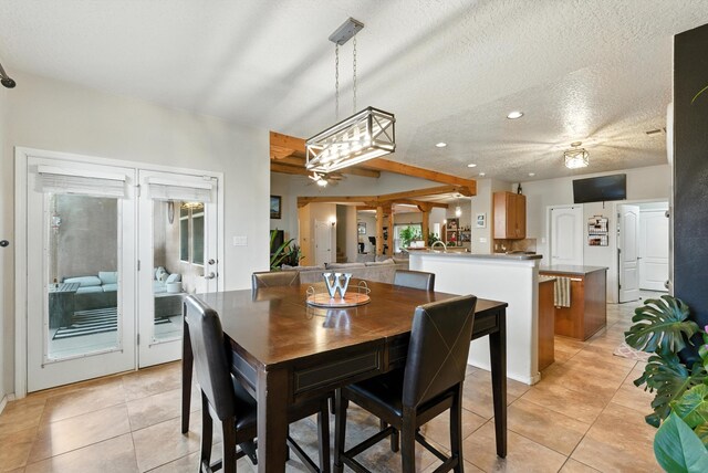 2004 Rancho Oro Ave SE, Rio Rancho, NM 87124 - dining room featuring light tile patterned floors, a textured ceiling, and recessed lighting