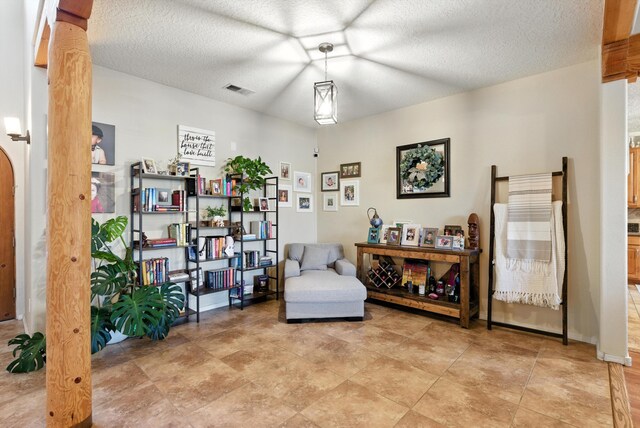 2004 Rancho Oro Ave SE, Rio Rancho, NM 87124 - living area featuring a textured ceiling