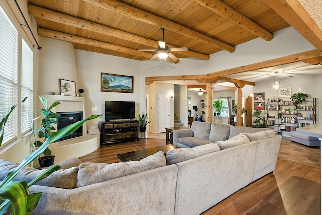 2004 Rancho Oro Ave SE, Rio Rancho, NM 87124 - living room featuring a ceiling fan, wood finished floors, a wooden ceiling with exposed beams, and a large fireplace