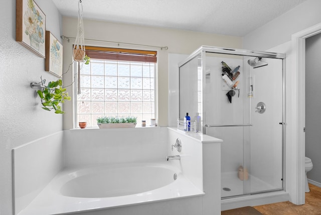 2004 Rancho Oro Ave SE, Rio Rancho, NM 87124 - bathroom with a stall shower, a bath, and a textured ceiling