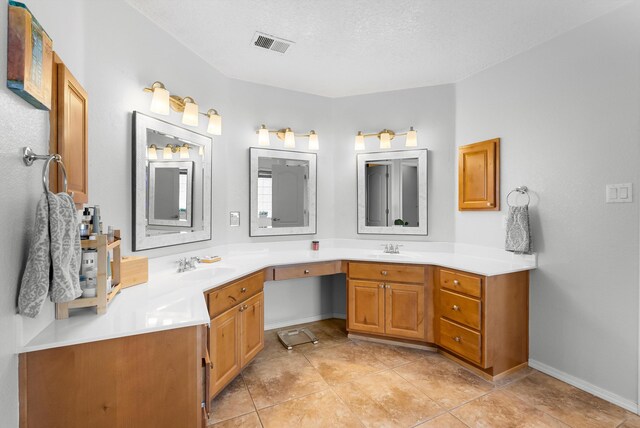 2004 Rancho Oro Ave SE, Rio Rancho, NM 87124 - bathroom featuring double vanity and tile patterned flooring