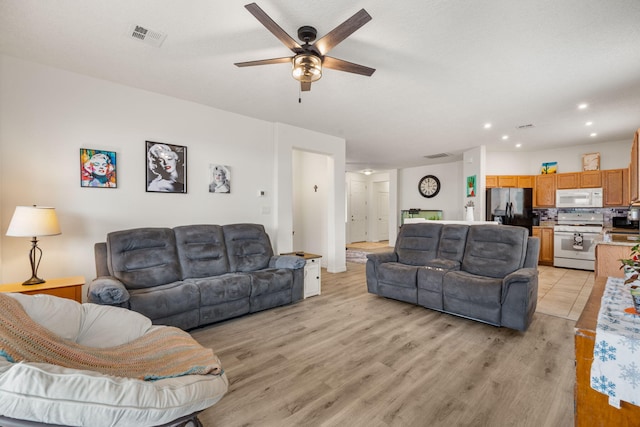 240 Rio Chama Cir SW, Los Lunas, NM 87031 - living area featuring ceiling fan, light wood-type flooring, and recessed lighting