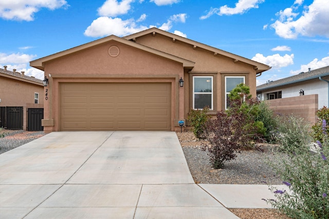 240 Rio Chama Cir SW, Los Lunas, NM 87031 - ranch-style home with stucco siding, concrete driveway, and a garage