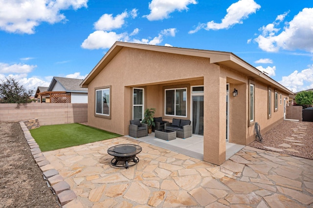 240 Rio Chama Cir SW, Los Lunas, NM 87031 - rear view of house featuring stucco siding, a patio area, a fenced backyard, and an outdoor living space with a fire pit