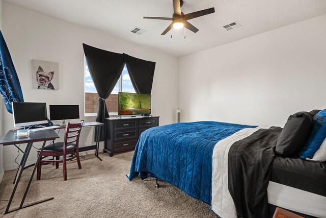 240 Rio Chama Cir SW, Los Lunas, NM 87031 - bedroom featuring light carpet, an office area, and a ceiling fan