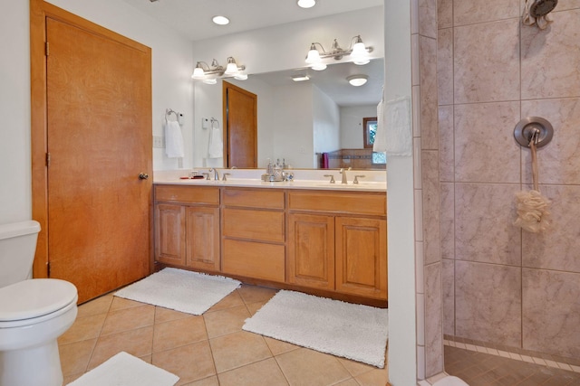 800 Jim St, Socorro, NM 87801 - full bath featuring toilet, double vanity, tile patterned flooring, tiled shower, and recessed lighting