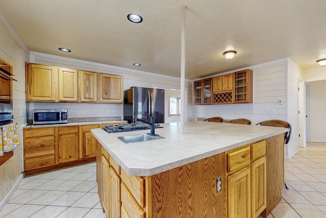 41 El Rancho Grande Rd, Mcintosh, NM 87032 - kitchen featuring stainless steel appliances, light countertops, light tile patterned flooring, an island with sink, and recessed lighting