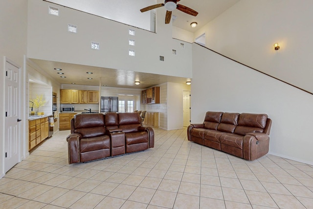 41 El Rancho Grande Rd, Mcintosh, NM 87032 - living area featuring light tile patterned floors, a ceiling fan, and a towering ceiling