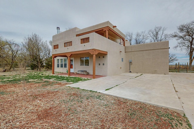 41 El Rancho Grande Rd, Mcintosh, NM 87032 - rear view of property with a patio and stucco siding