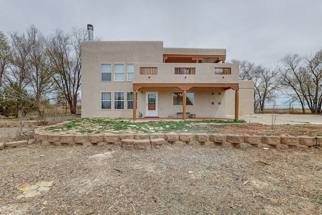 41 El Rancho Grande Rd, Mcintosh, NM 87032 - view of front facade with a balcony, a patio, and stucco siding