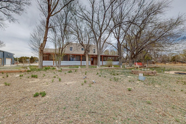 41 El Rancho Grande Rd, Mcintosh, NM 87032 - view of front of home featuring a sunroom and a garage
