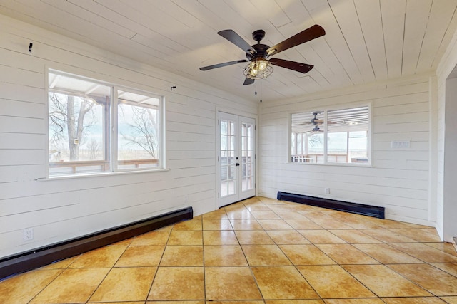 41 El Rancho Grande Rd, Mcintosh, NM 87032 - unfurnished sunroom featuring a baseboard heating unit, french doors, and a baseboard radiator