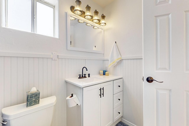 41 El Rancho Grande Rd, Mcintosh, NM 87032 - bathroom featuring vanity, a wainscoted wall, and a decorative wall