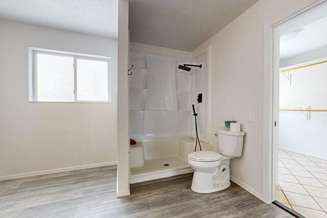 41 El Rancho Grande Rd, Mcintosh, NM 87032 - full bathroom with a shower, a walk in closet, and wood finished floors